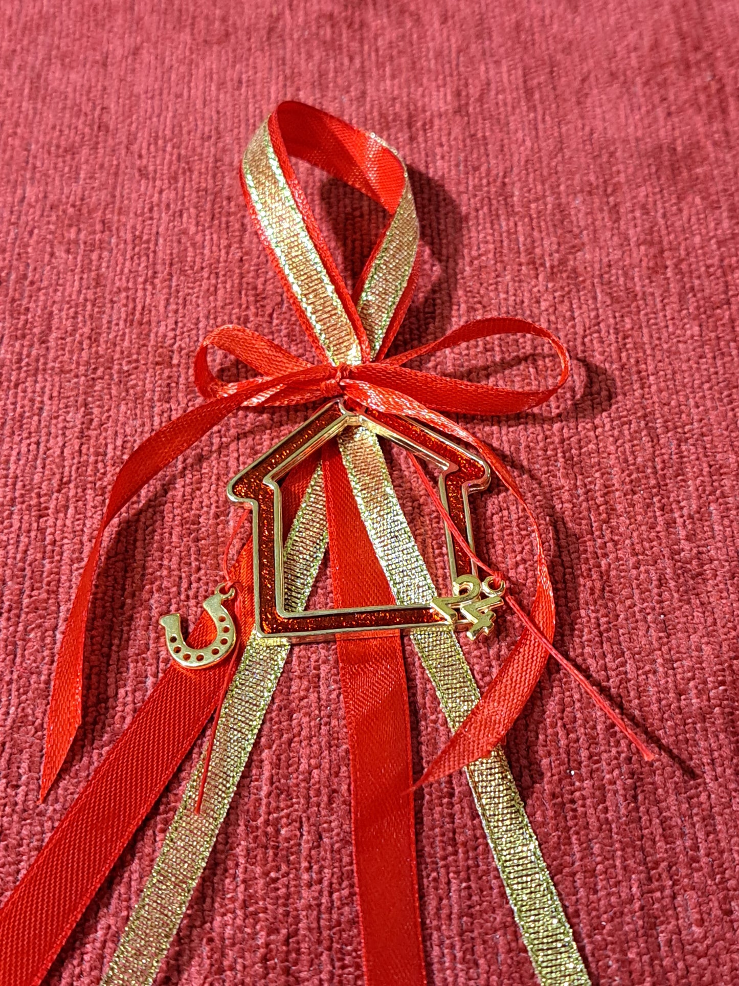 House with red enamel, lucky charm 2024.