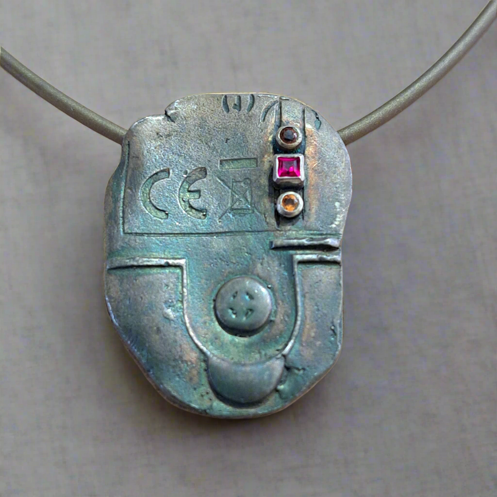 Handmade sterling silver necklace with precious gems
