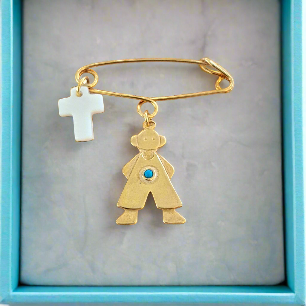 Handmade gold plated silver pin with a boy and a mother of pearl cross