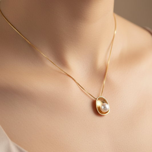 14K Gold necklace with a round pearl