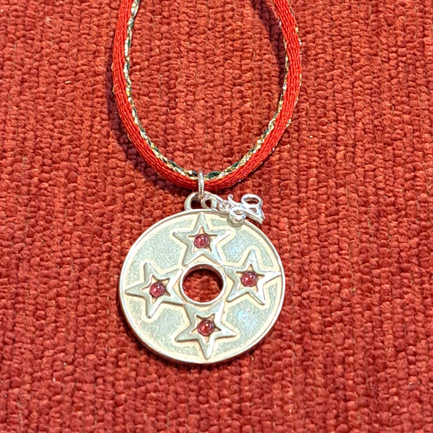 Sterling siver lucky charm with stars with garnets