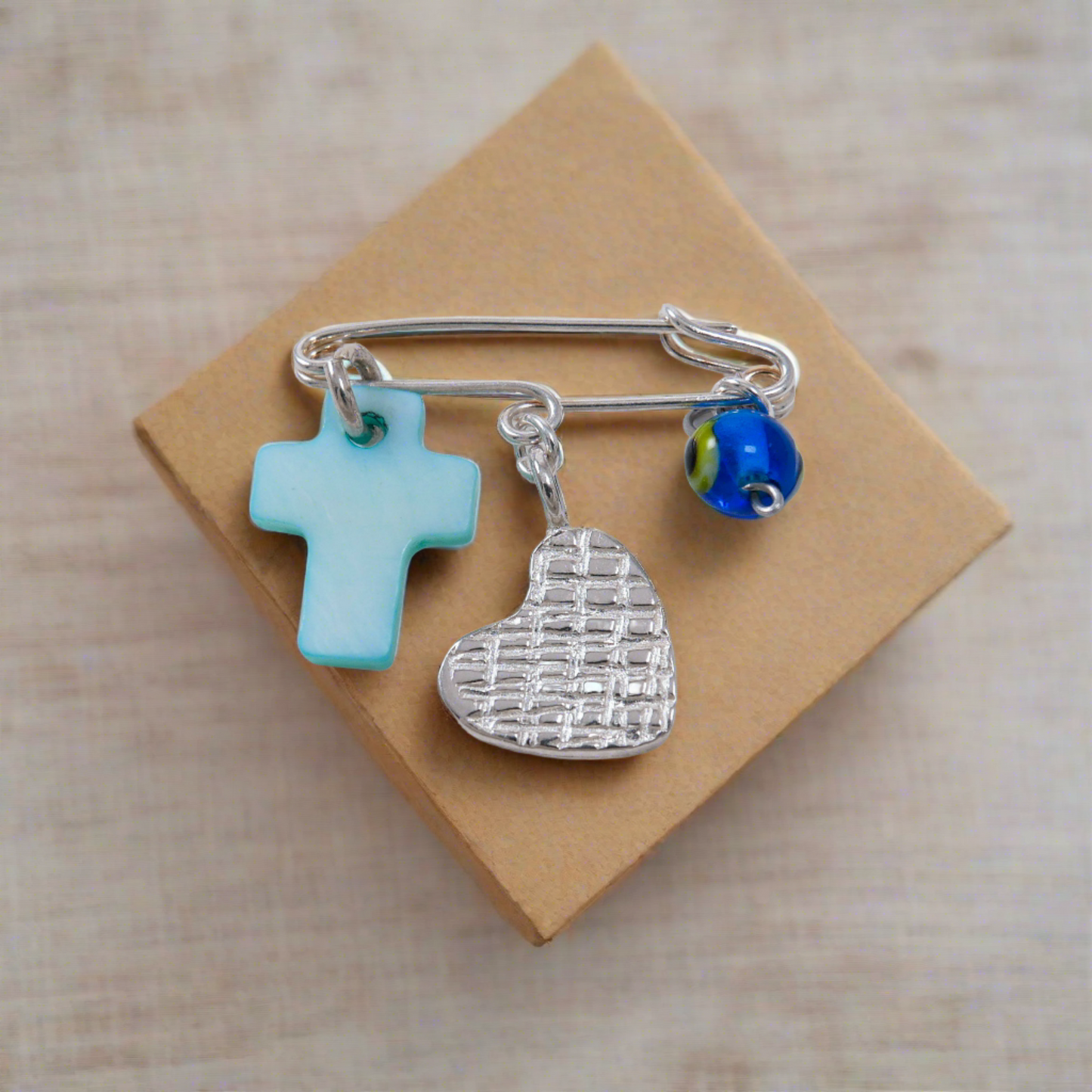 Baby sterling silver Pin with a heart, a cross and an evil eye
