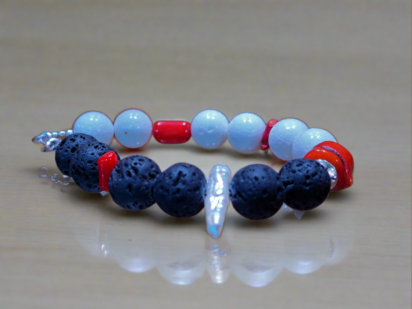 Bracelet  with black lava, red and white corals, sterling silver and a pearl