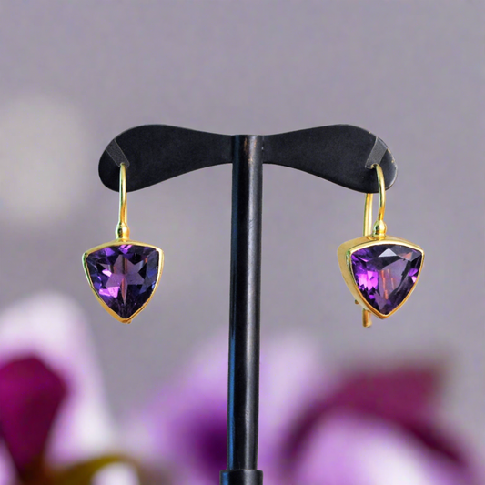 18k Gold earrings with  amethysts.