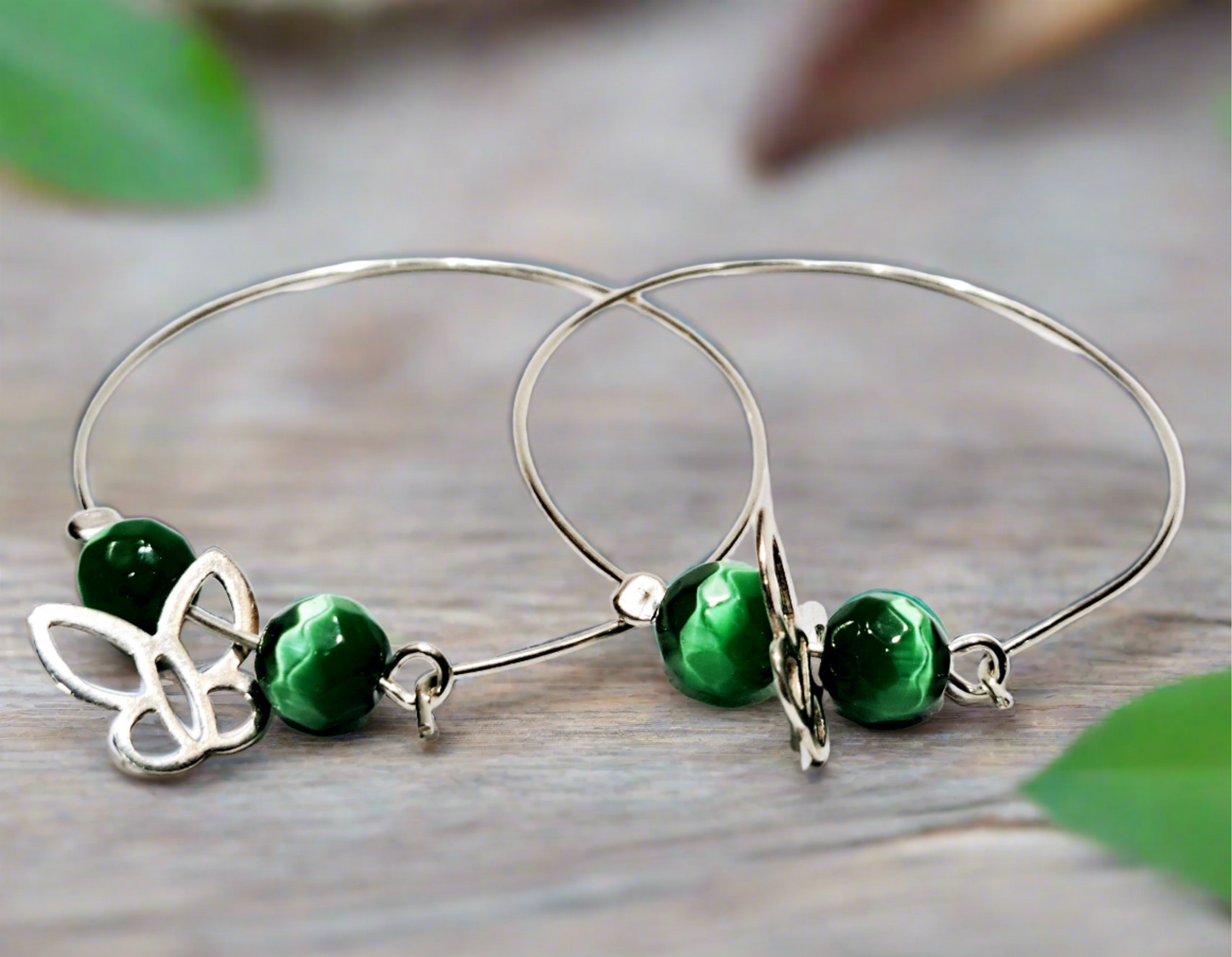 Handmade sterling silver hoops with green beads and butterfies