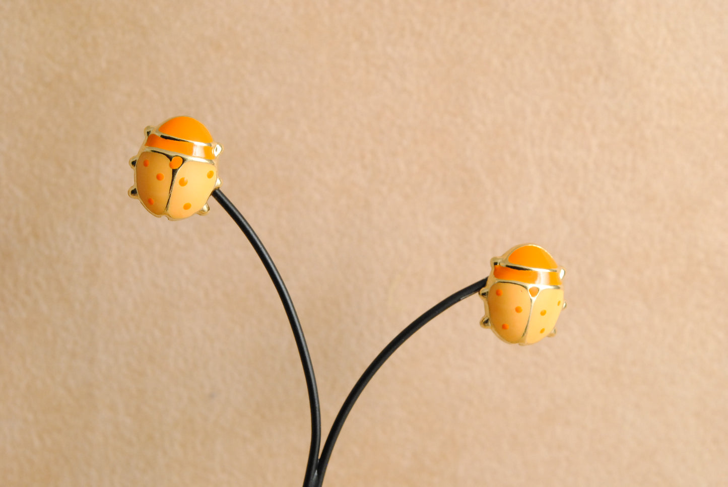 Orange ladybags stud earrings made by 18K Gold