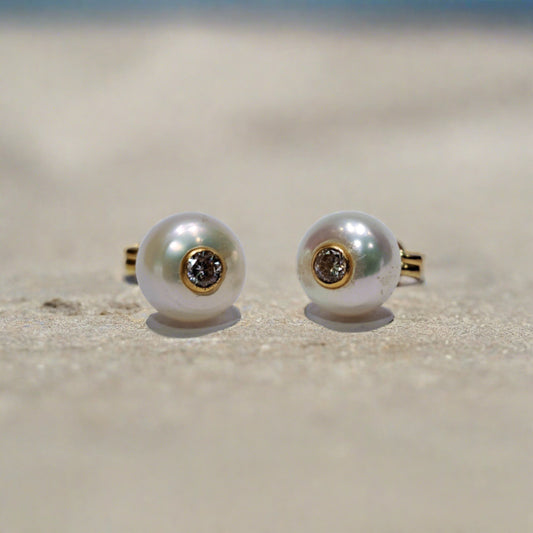 Stud  14k Gold earrings with pearls and zirkons inside