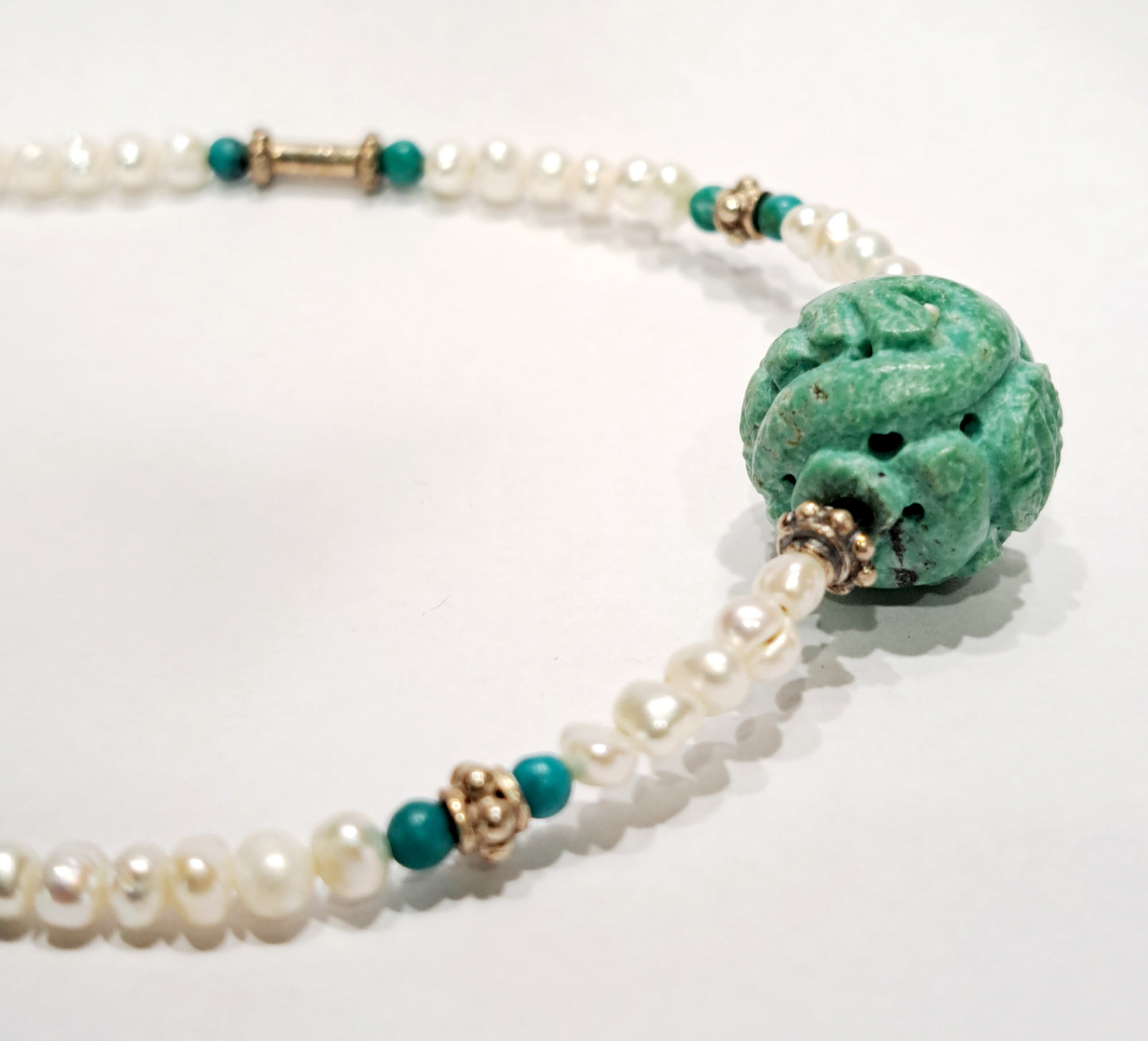 Handmade necklace with turquoise, pearls and sterling silver.