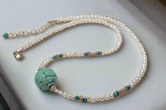 Handmade necklace with turquoise, pearls and sterling silver.
