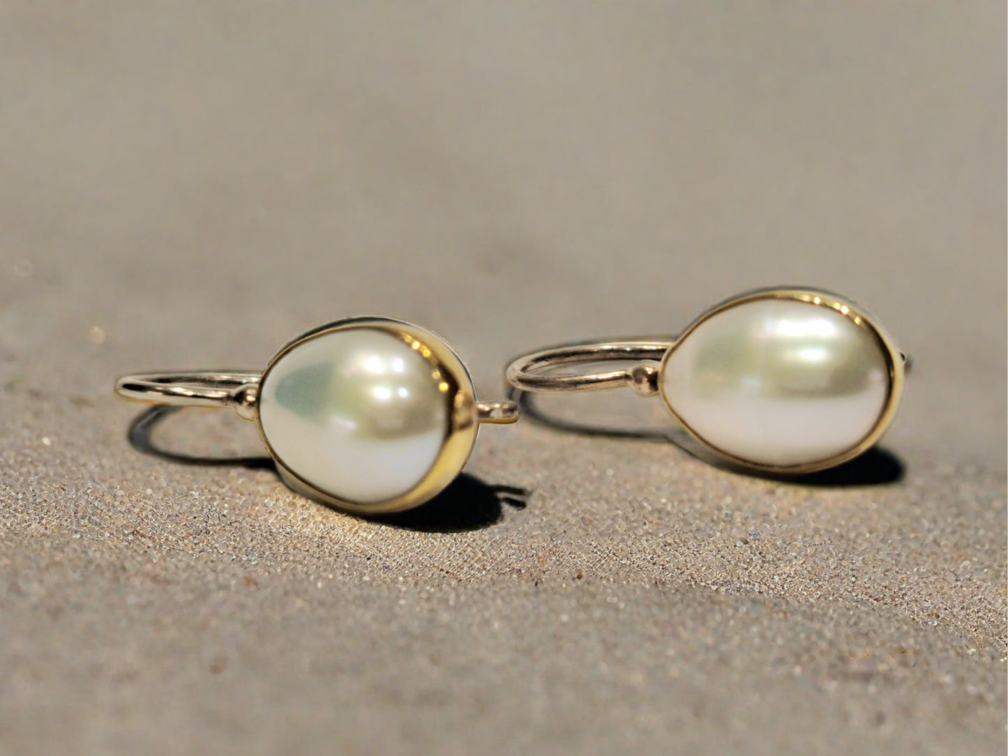 18K gold and silver earrings with oval pearls