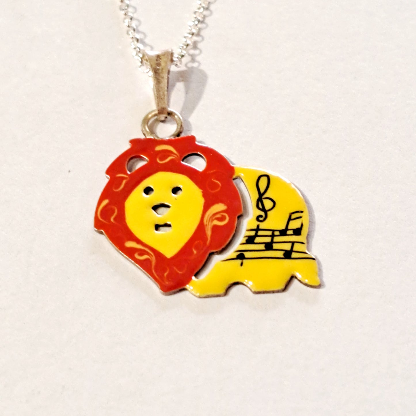 Lion silver necklace painted with yellow and red colors