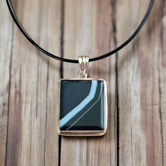 Sterling silver pendant with a unique black and white onyx gemstone