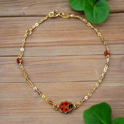 14K Gold bracelet with a lady bag