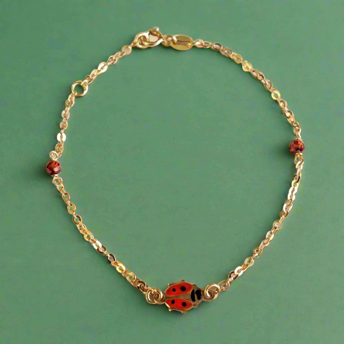 14K Gold bracelet with a lady bag