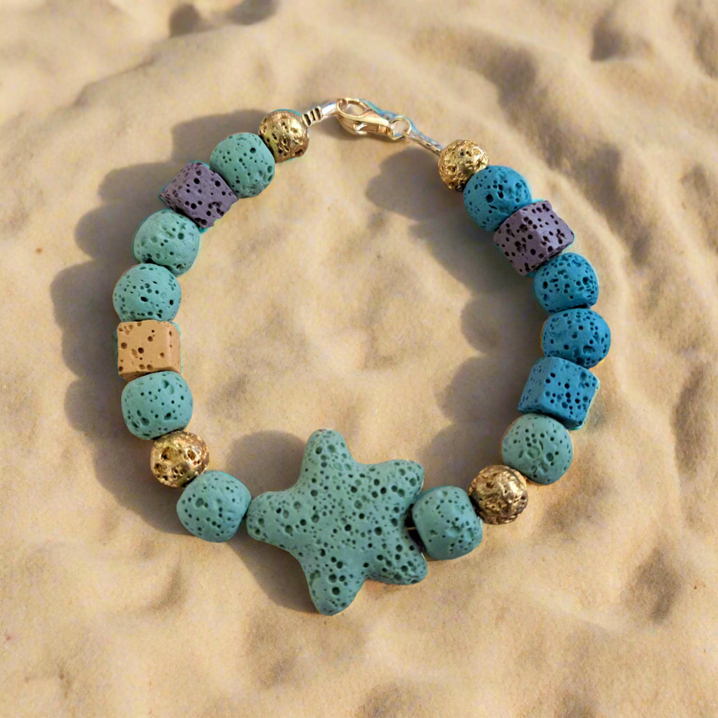 Handmade bracelet with blue , green, beige lawa beads with gold plated sterling silver clasp.