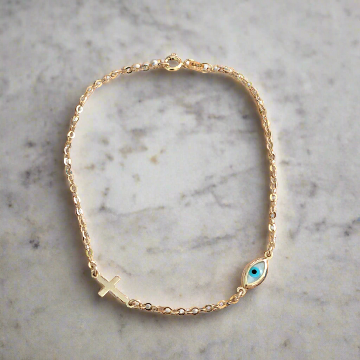 9K Gold bracelet with cross and evil eye