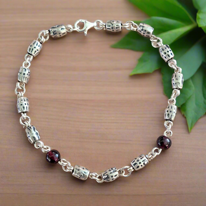 Handmade sterling silver bracelet with garnets