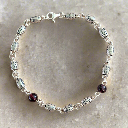 Handmade sterling silver bracelet with garnets