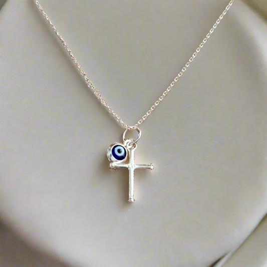 Sterling silver tiny cross with an evil eye