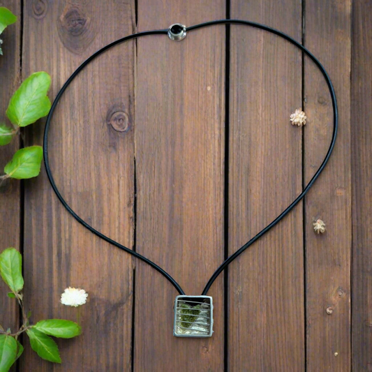 Handmade sterling silver neckclace with a peridot heart