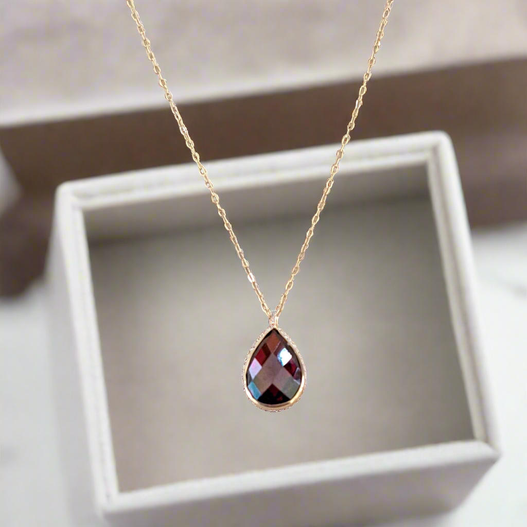 Gold necklace 14Κ with dark red zirkon drop