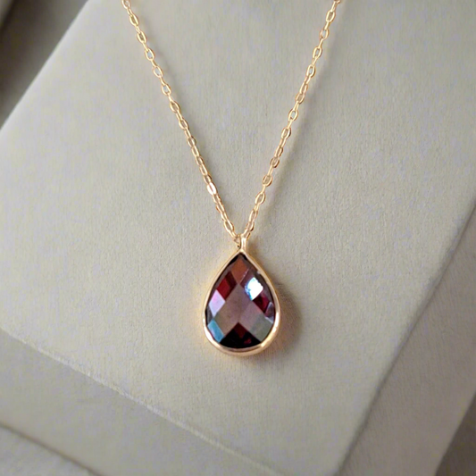 Gold necklace 14Κ with dark red zirkon drop