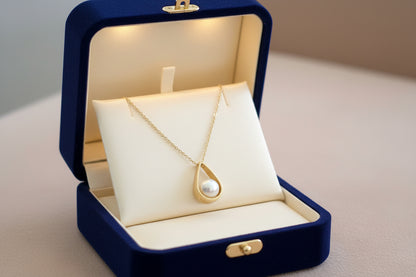 9K Gold  drop shaped pendant with  a pearl