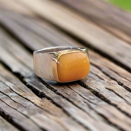Handmade sterling silver and 18K ring with an amber