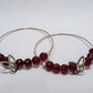 Handmade sterling silver hoops with red beads and butterflies