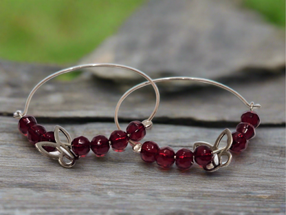 Handmade sterling silver hoops with red beads and butterflies