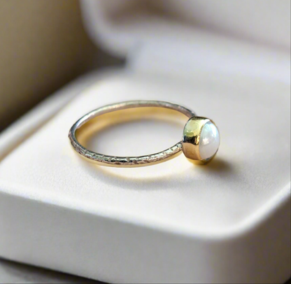 Handmade sterling silver ring with 18K gold and a pearl.