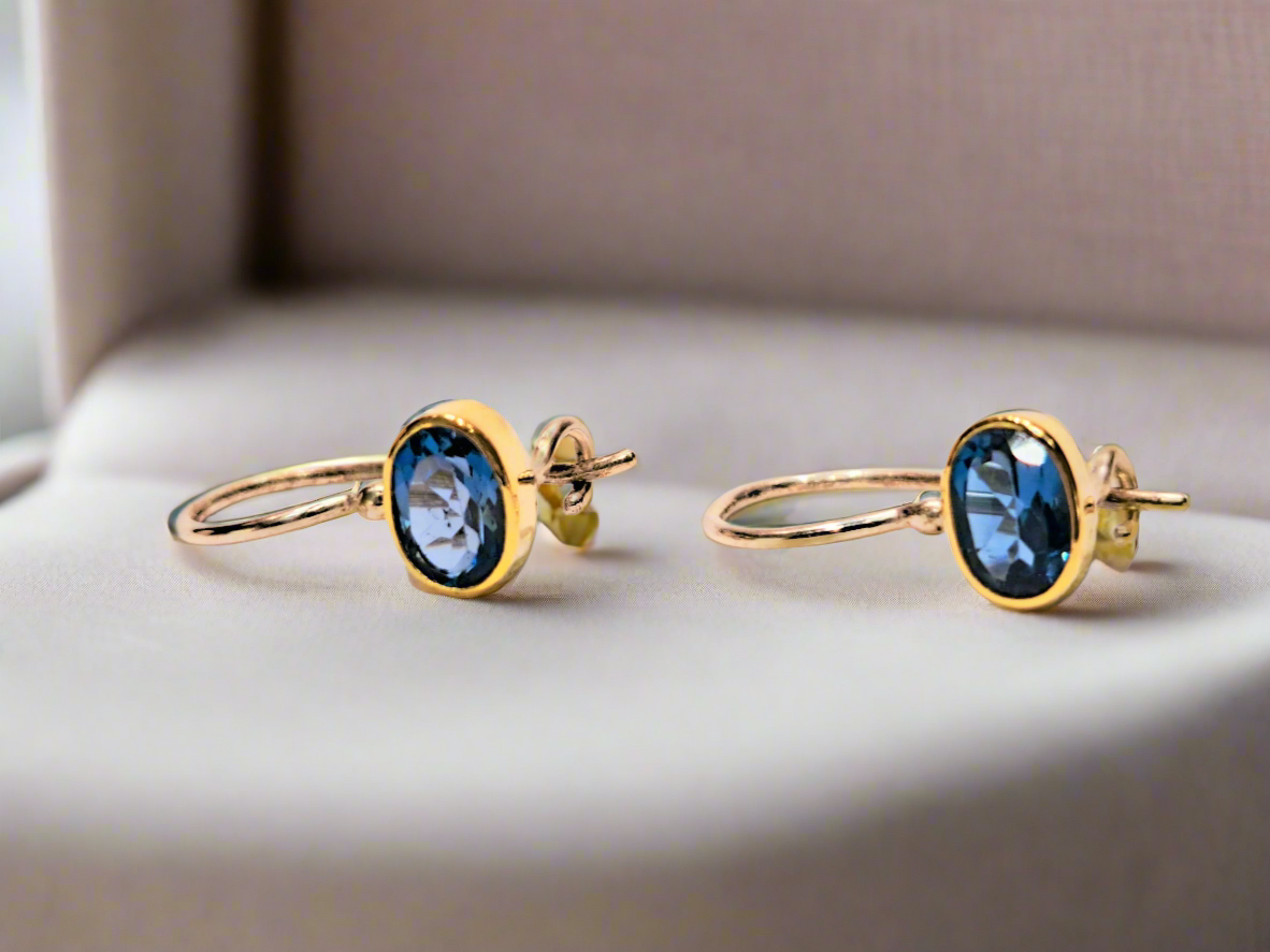 Handmade earrings with 18K gold and silver with blue topaz