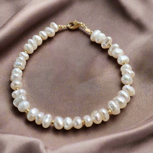 Handmade bracelet with fresh water pearls and gold plated silver elements