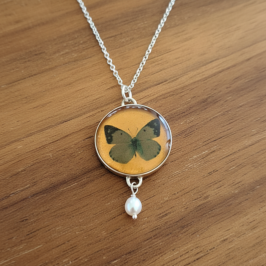Handmade sterling silver pendant with a butterfly and and a pearl - Katerina Roukouna