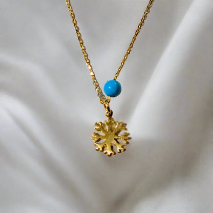 Snowflake 14K gold necklace  with chain and with a blue turrqoise gemstone near the snowflake