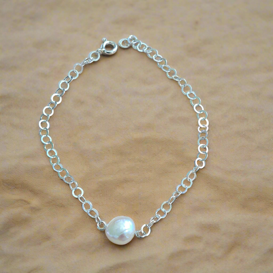 Handmade sterling silver bracelet with a fresh water pearl.