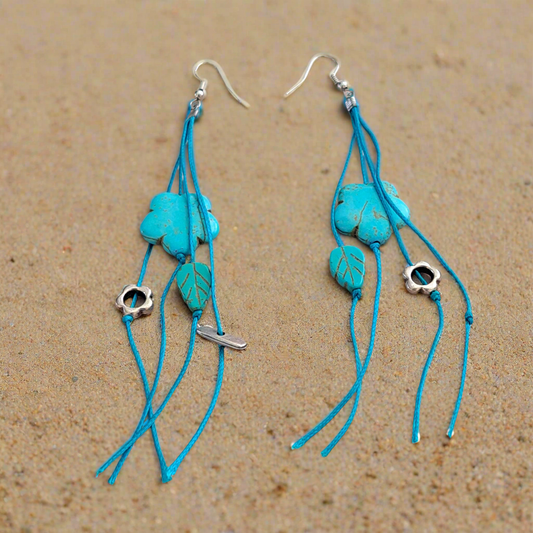 Handmade earrings with haolites and metallic elements.