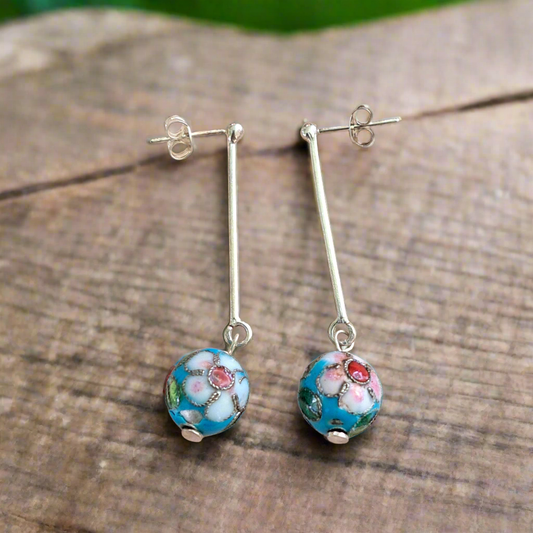 Sterling silver earrings with turquoise handmade metallic beads.