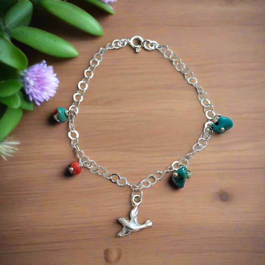 Handmade sterling silver bracelet with  bird turquoise and a coral