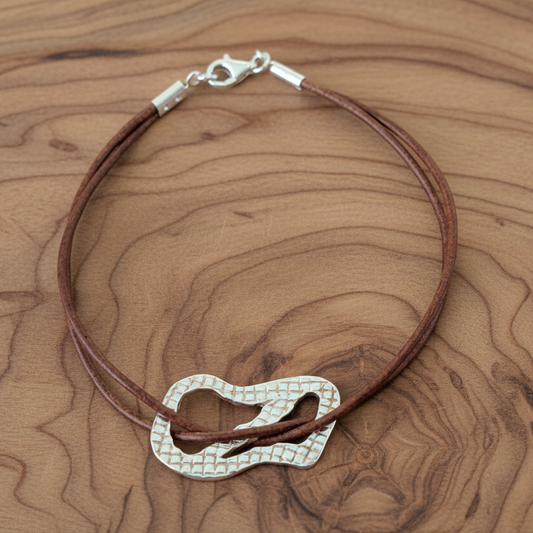 Handmade textured sterling silver bracelet with leather. - Katerina Roukouna
