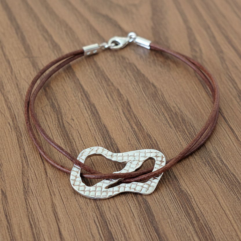 Handmade textured sterling silver bracelet with leather. - Katerina Roukouna