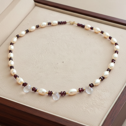 Handmade necklace with pearls, garnets, quartz and 18k gold.
