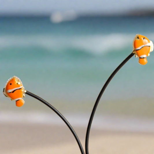  18K gold earrings feature a playful fish-nemo adorned with vibrant enamel