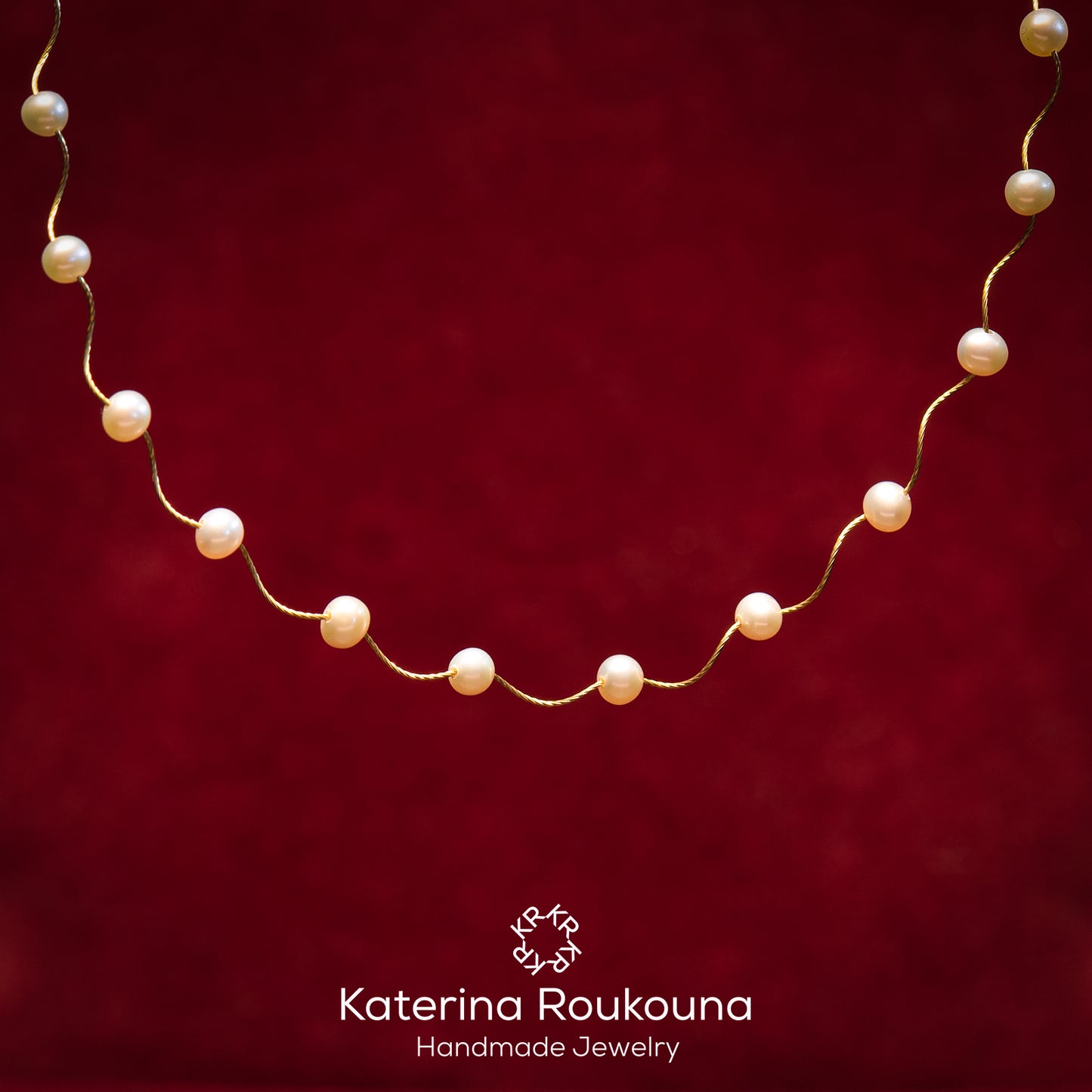 18k Gold wave necklace with pearls