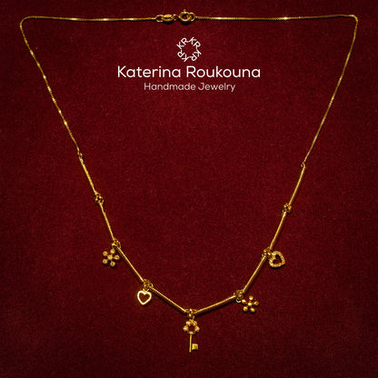 14k Gold necklace with charms