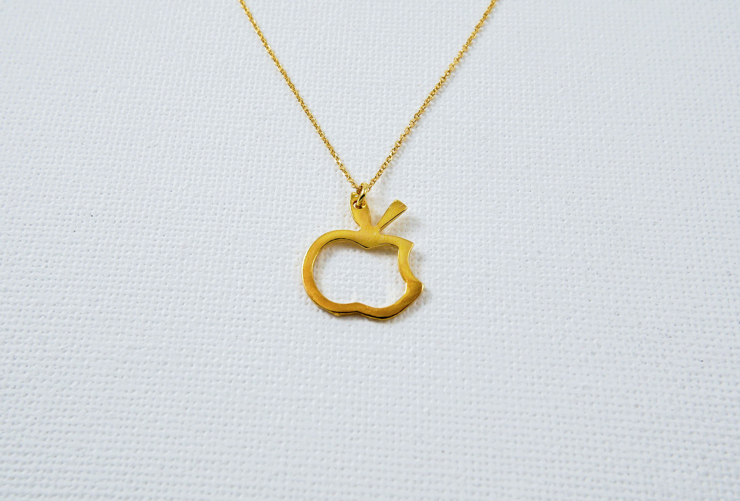 Apple  goldplated sterling silver necklace- outline of a bitten apple