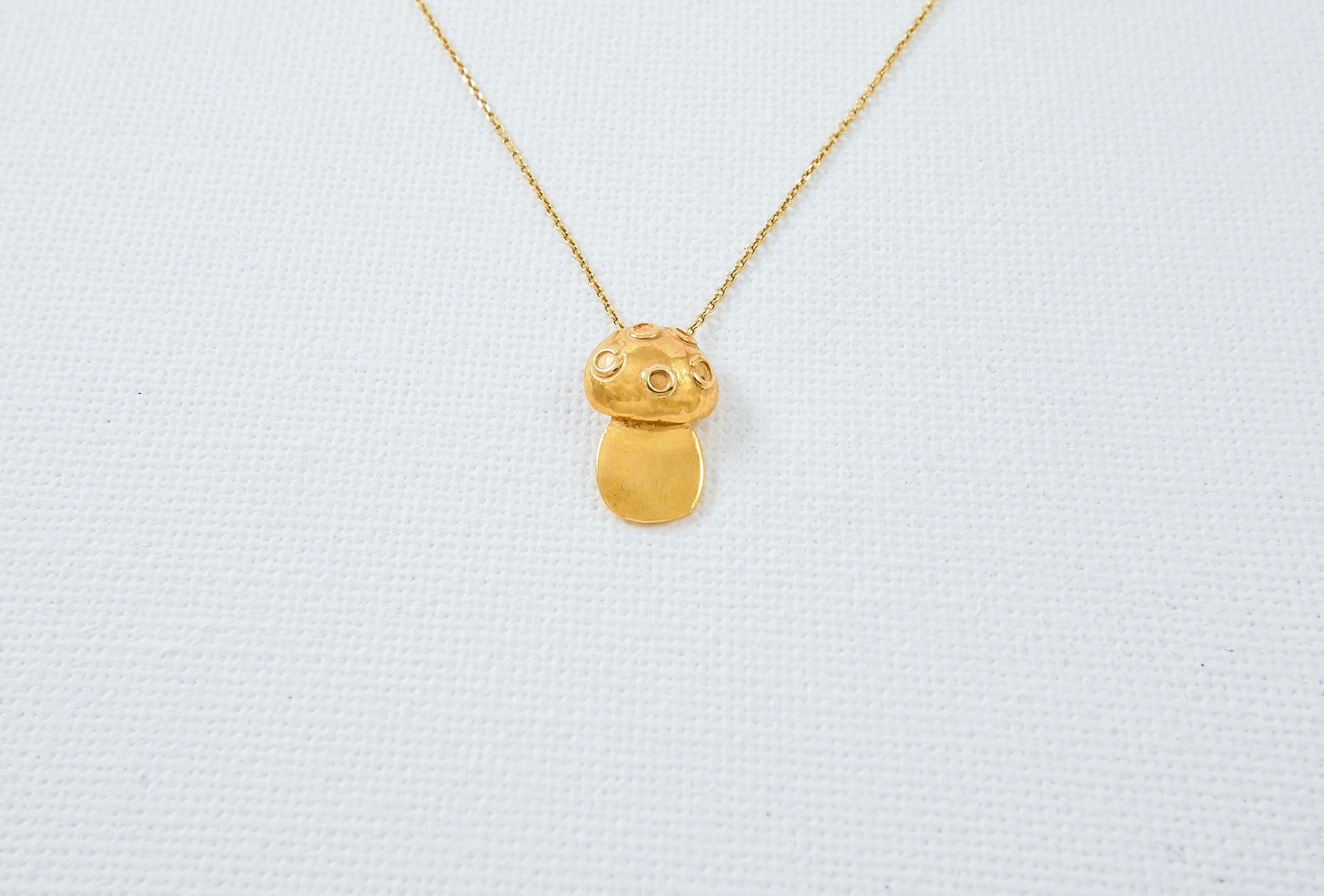 A gold plated silver  small mushroom necklace