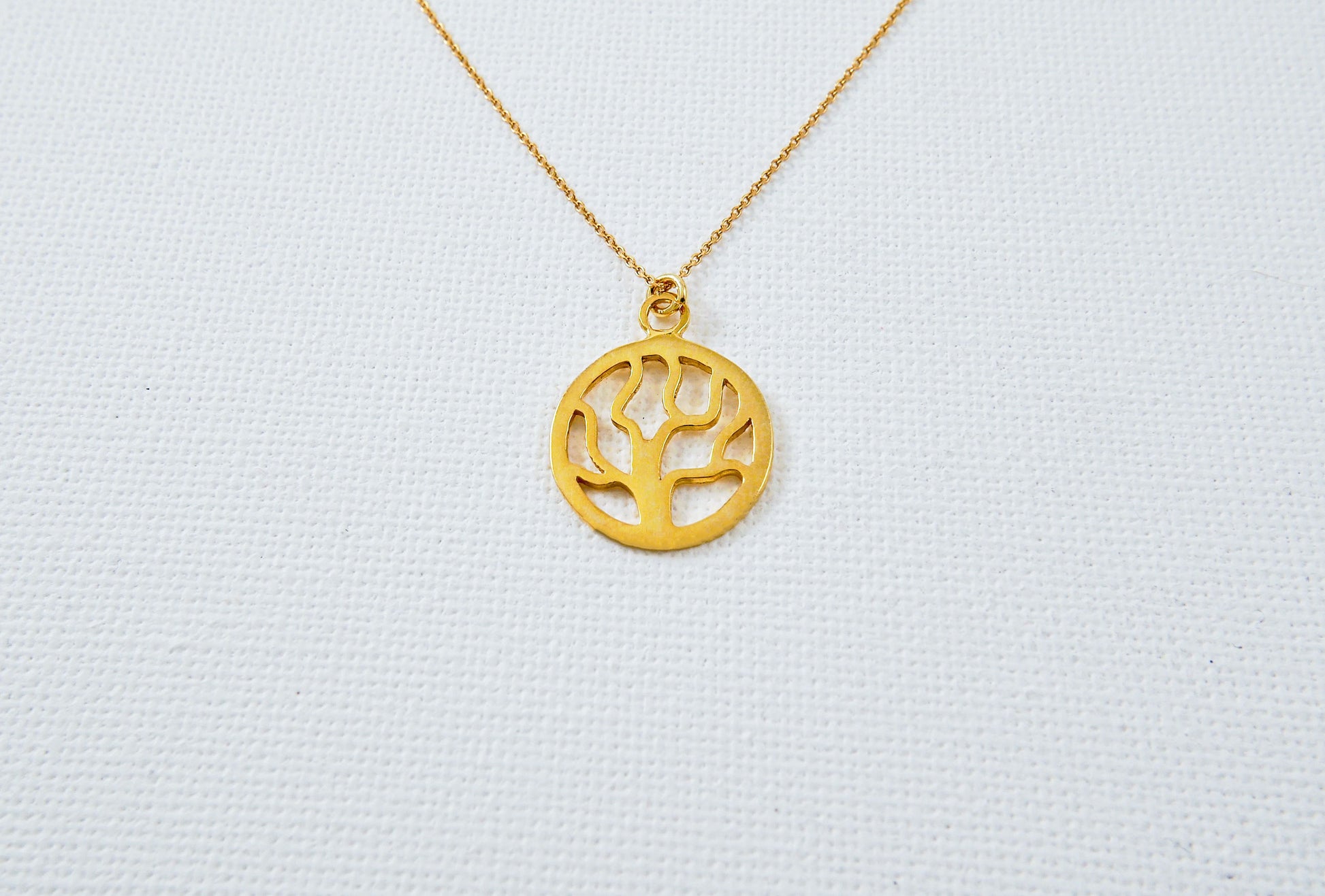 Small round goldplated silver necklace with a tree
