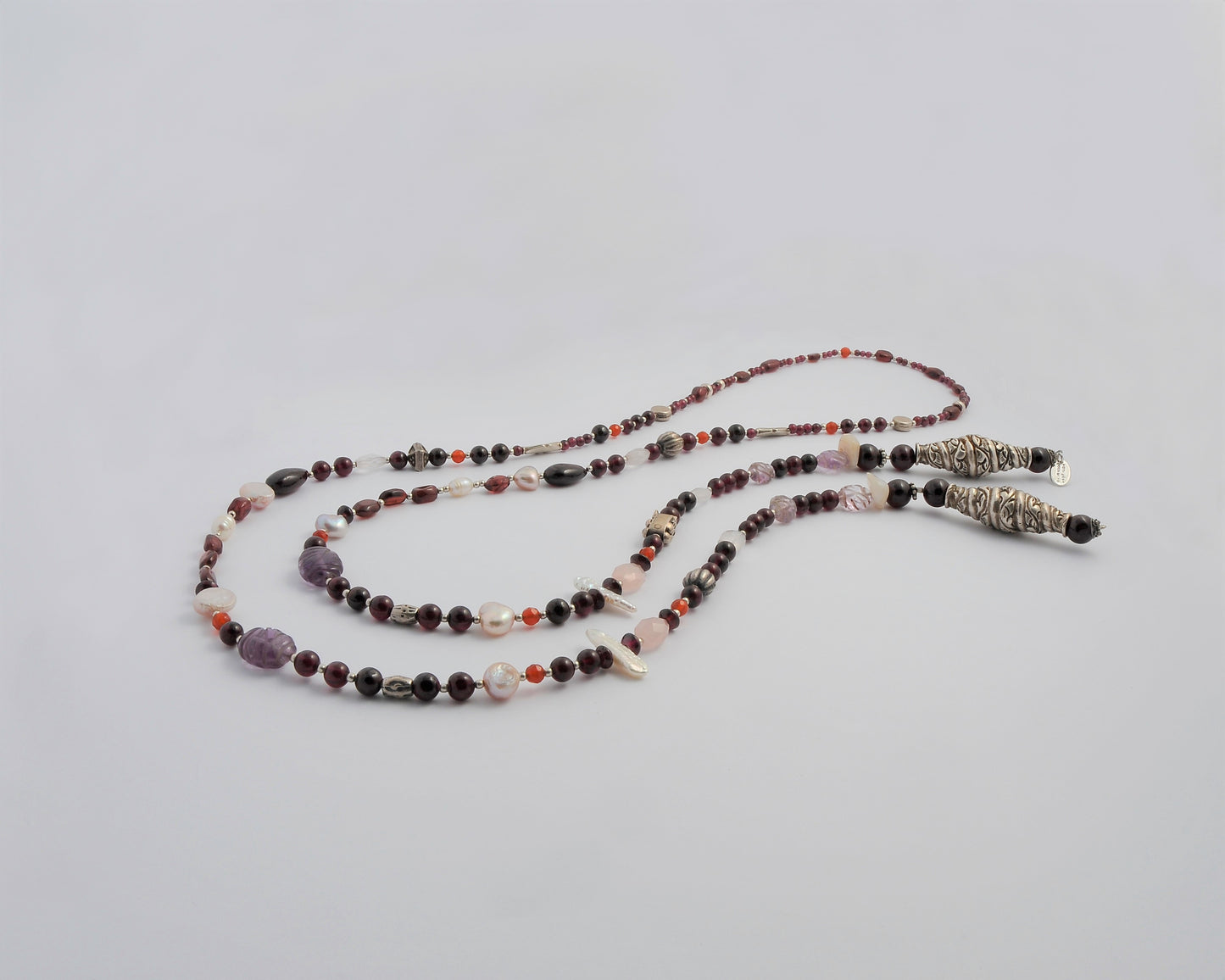 Multi color handmade long necklace with gems and sterling silver.