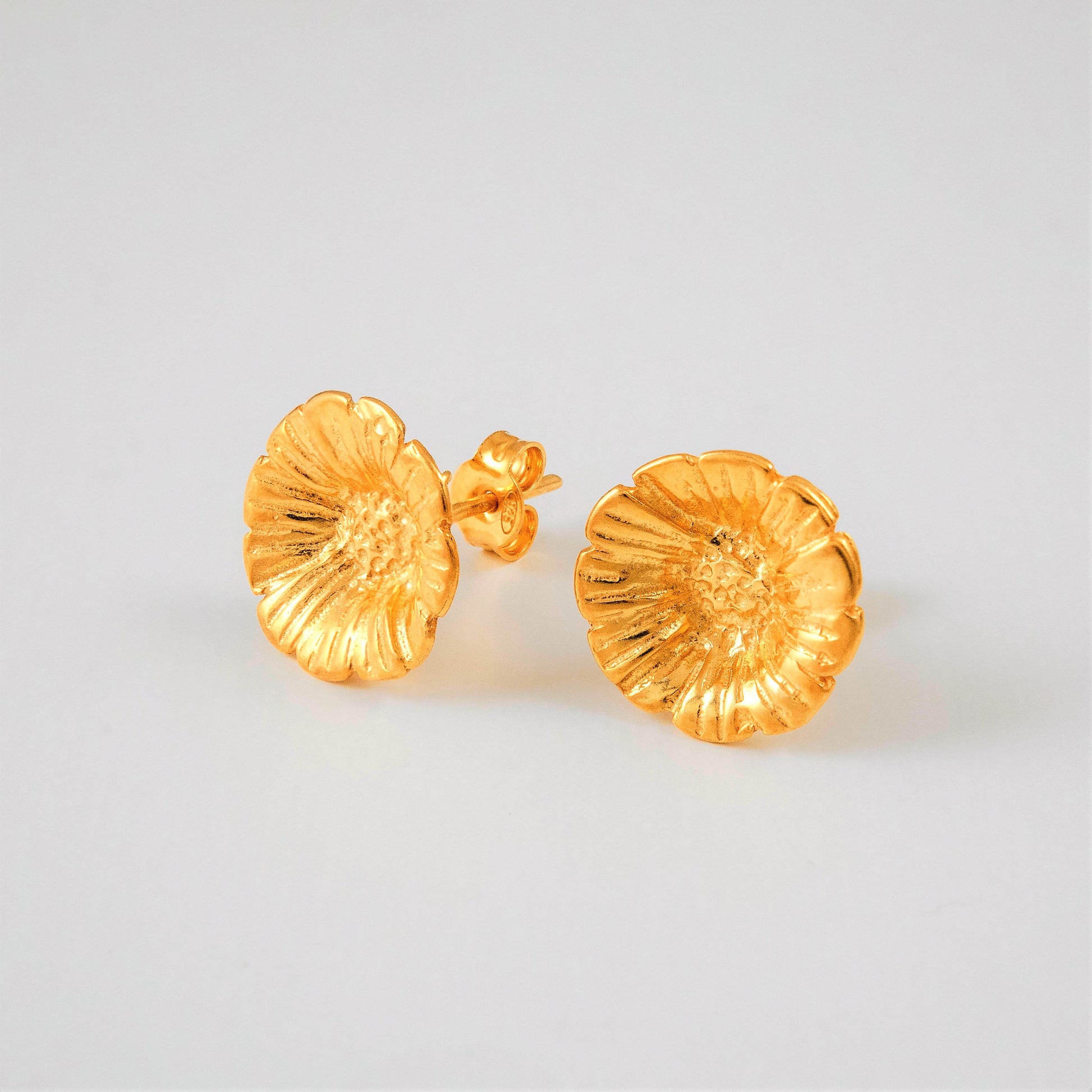 Tiny  gold plated stud earrings with anemones. -